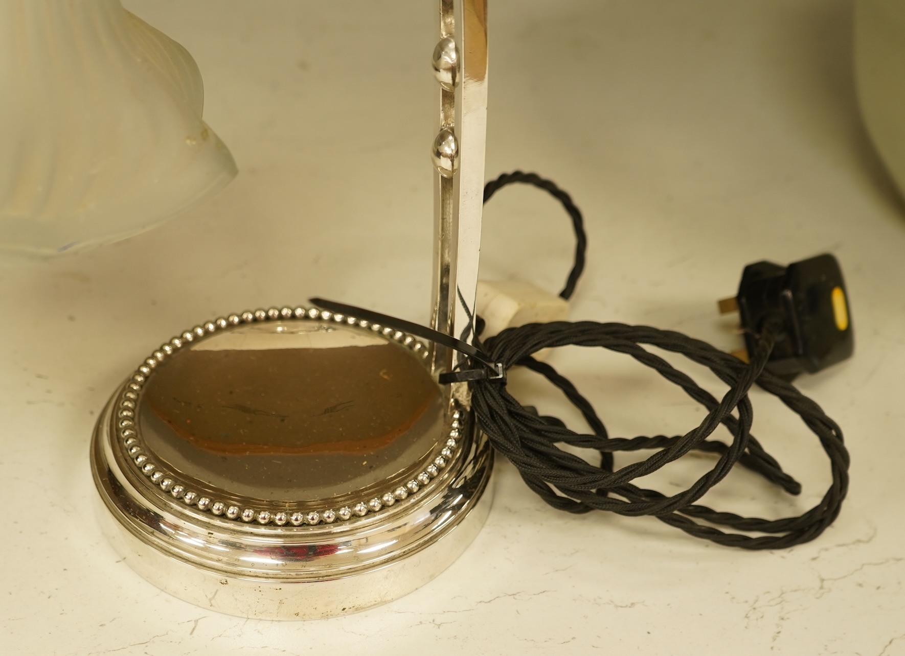 A plated adjustable desk light with opaque glass fluted shade, 35cm high